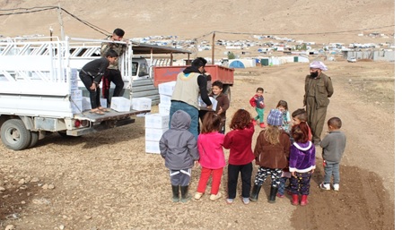 Children receiving winter clothes in Sinjar
